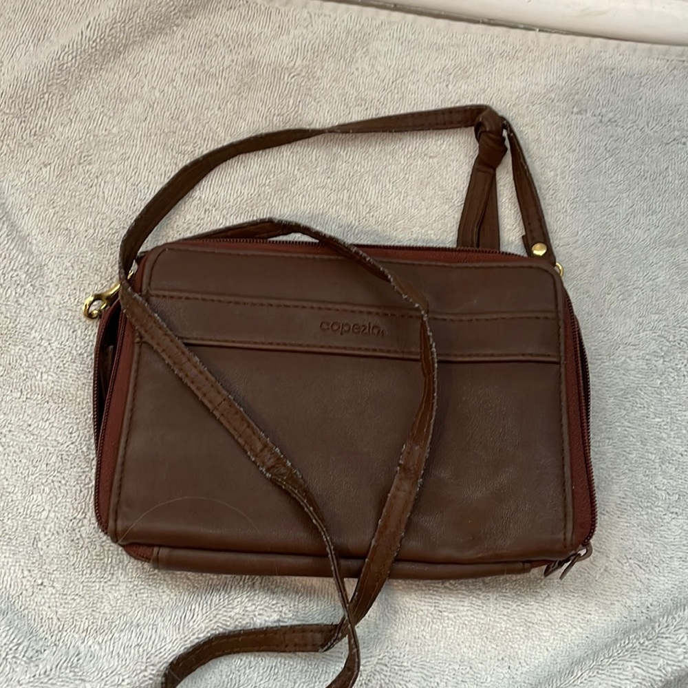 A faux leather brown capezia bag